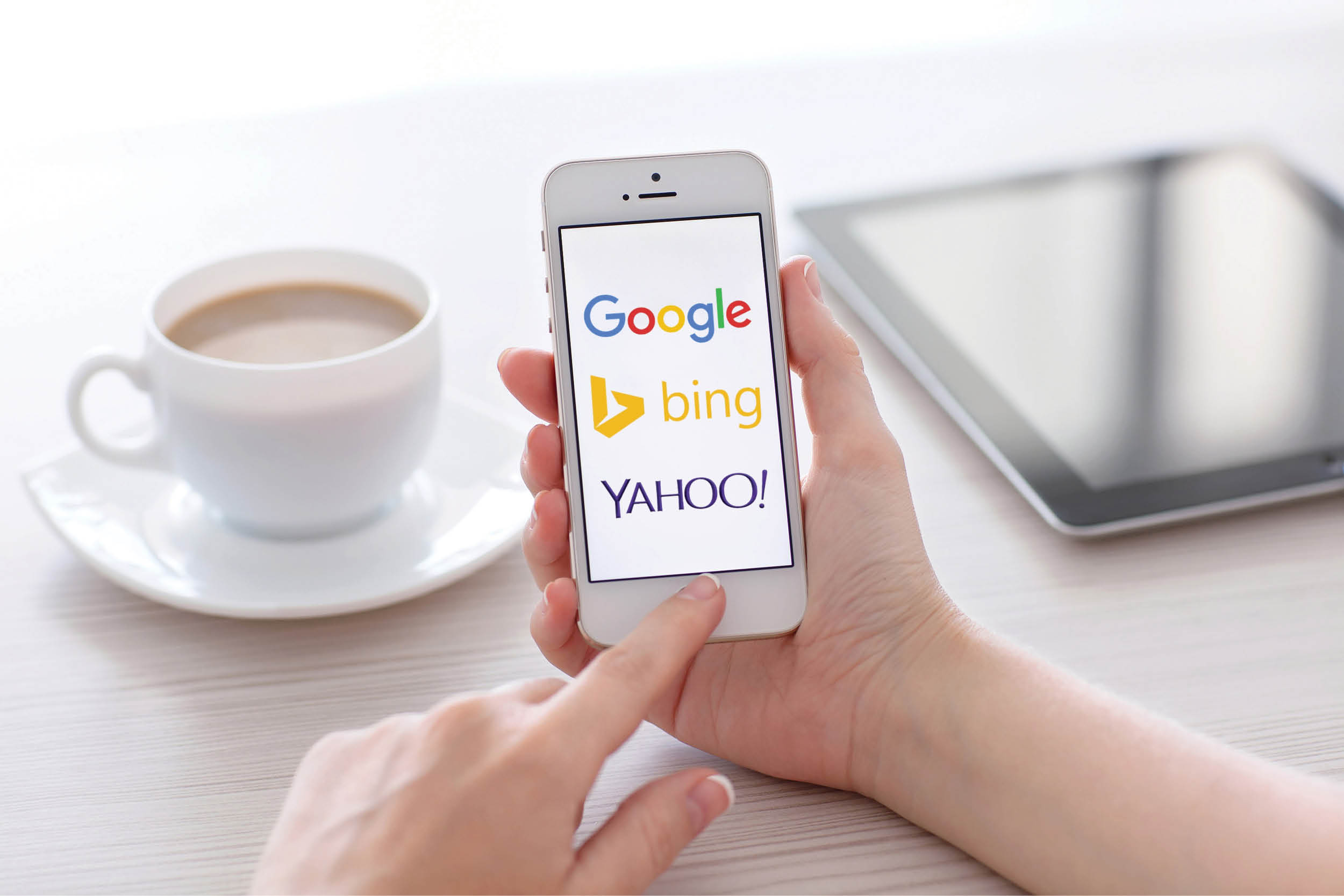 female-hands-holding-iphone-showing-3-main-search-engines-google-bing-and-yahoo