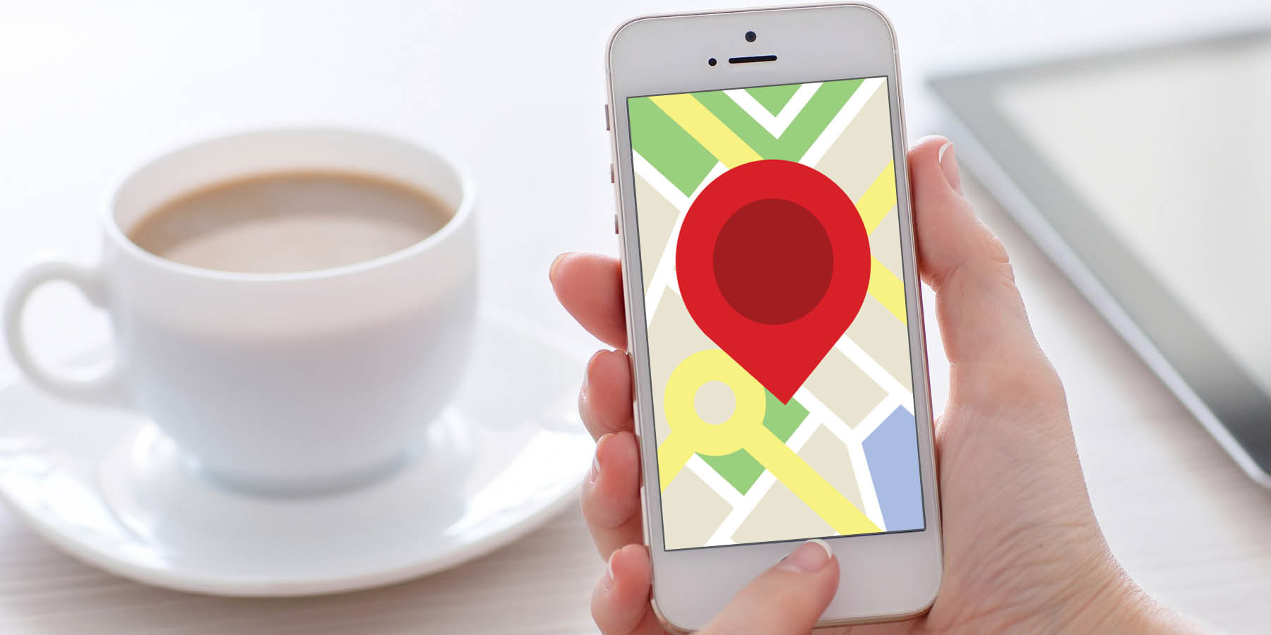 woman-holding-iphone-showing-a-red-pointer-on-top-of-a-google-map